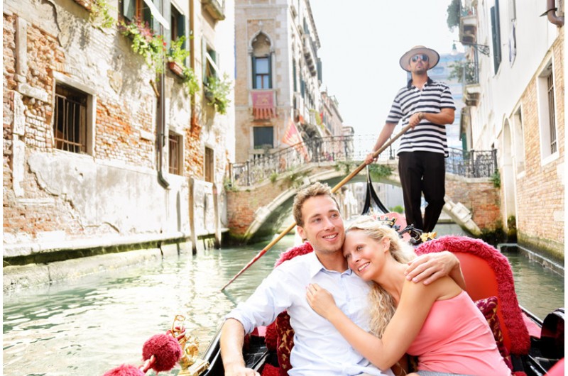 A couple inside a gondola on the Grand Canal in Venice